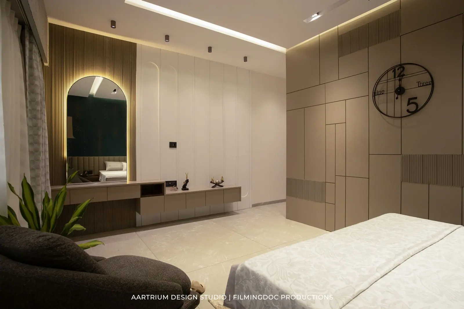Bedroom — panelled walls with an arched mirror and console forming a dressing corner.