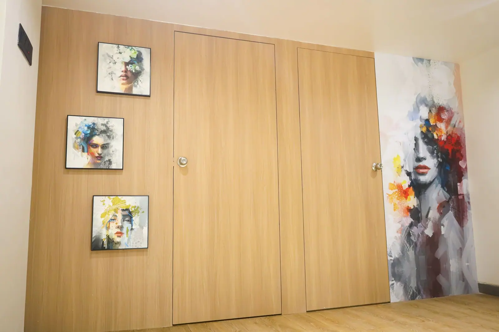 Rear wall — timber sliding doors framed by portrait artwork.